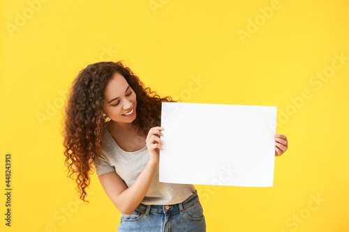 Young woman with blank post...