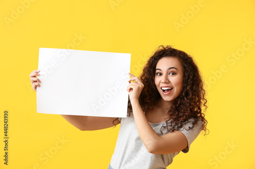 Young woman with blank post...