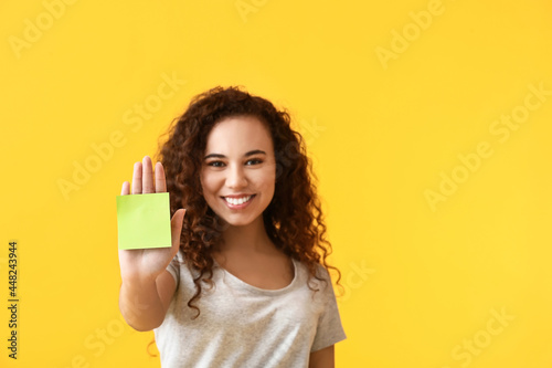 Young woman with sticker no...