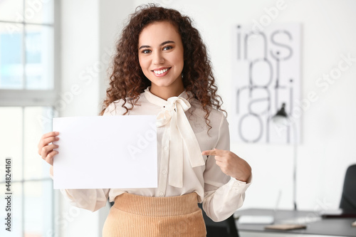 Young woman with blank pape...