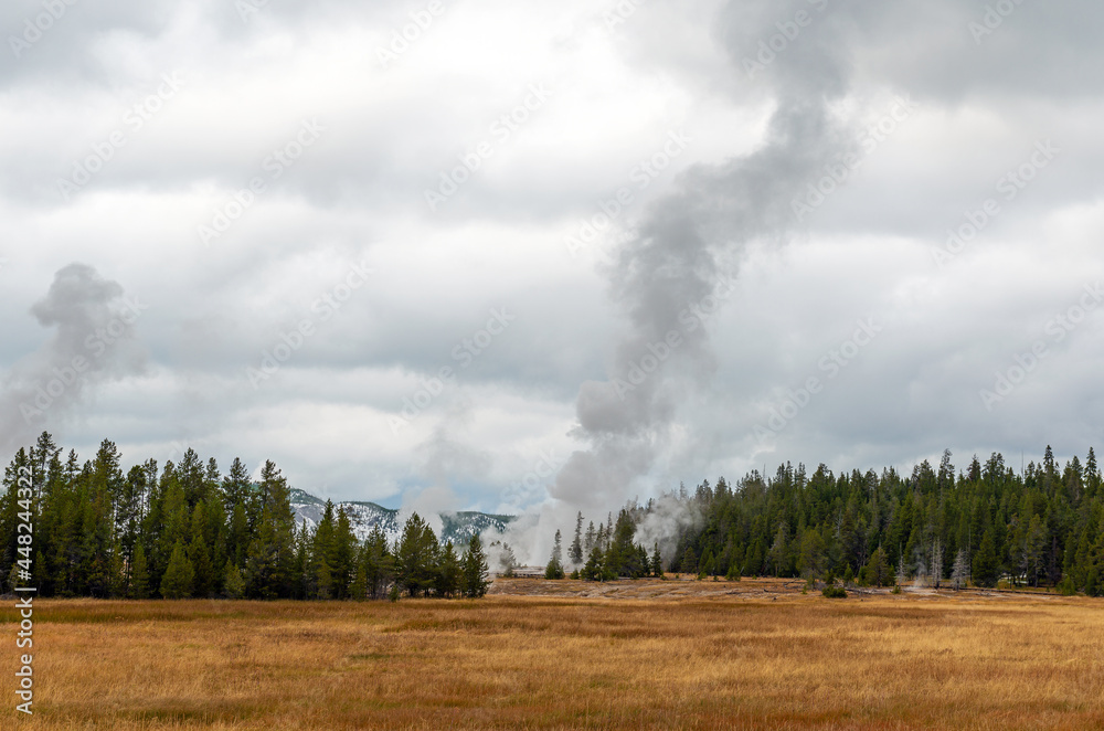 Geyser volcanic activity in autumn, Upper Geyser Basin, Yellowstone national park, Wyoming, USA. Geyser volcanic activity in autumn, Upper Geyser Basin, Yellowstone national park, Wyoming, USA.
