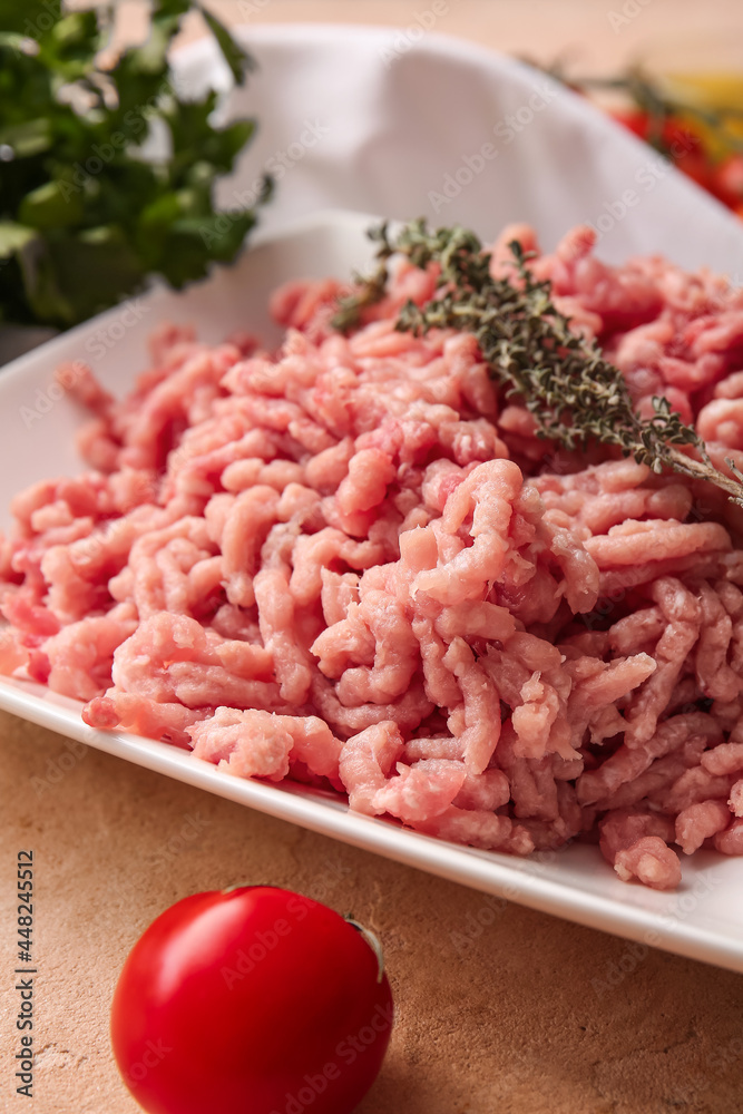 Plate with fresh forcemeat on table, closeup Plate with fresh forcemeat on table, closeup