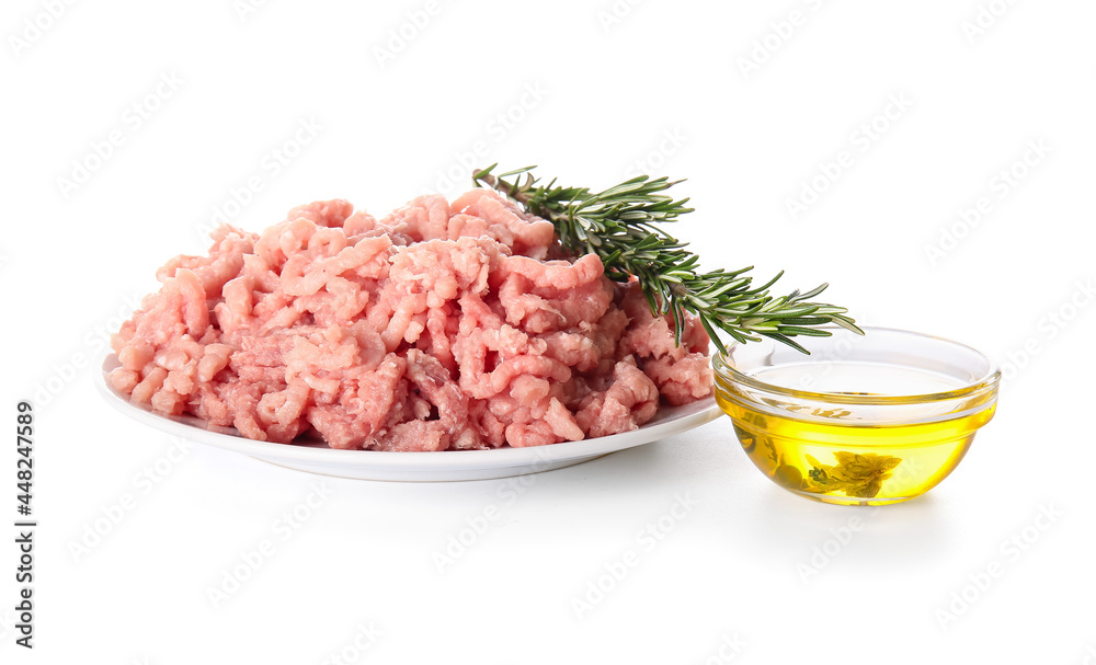 Plate with fresh forcemeat and spices on white background Plate with fresh forcemeat and spices on white background