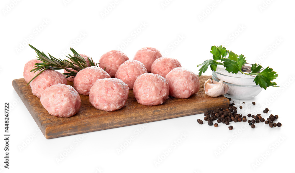 Wooden board with raw cutlets made of fresh forcemeat and ingredients on white background Wooden board with raw cutlets made of fresh forcemeat and ingredients on white background