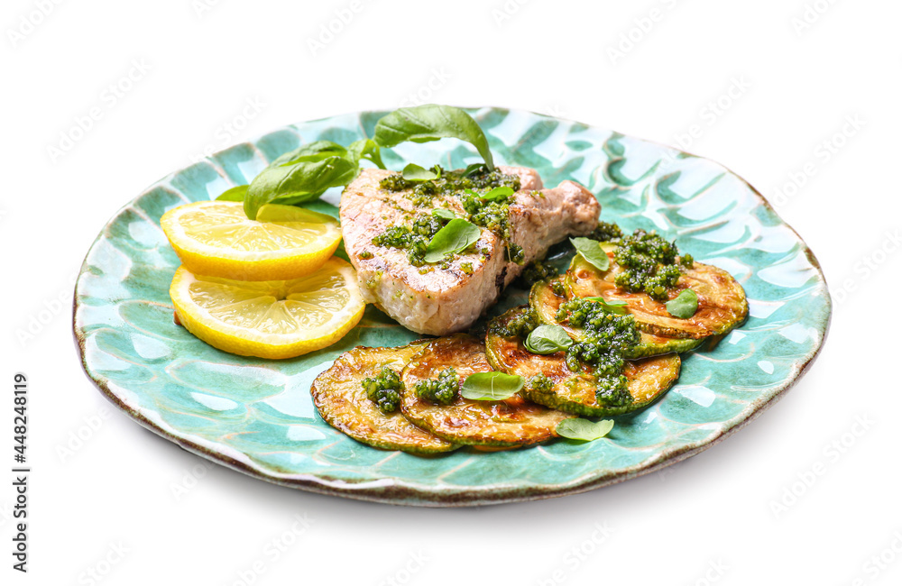 Plate with grilled zucchini, steak and pesto sauce on white background