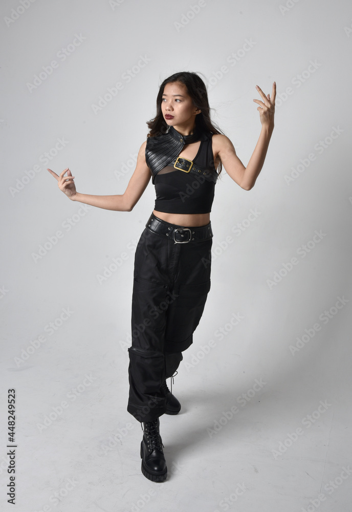 Full length portrait of pretty young asian girl wearing black tank top ...
