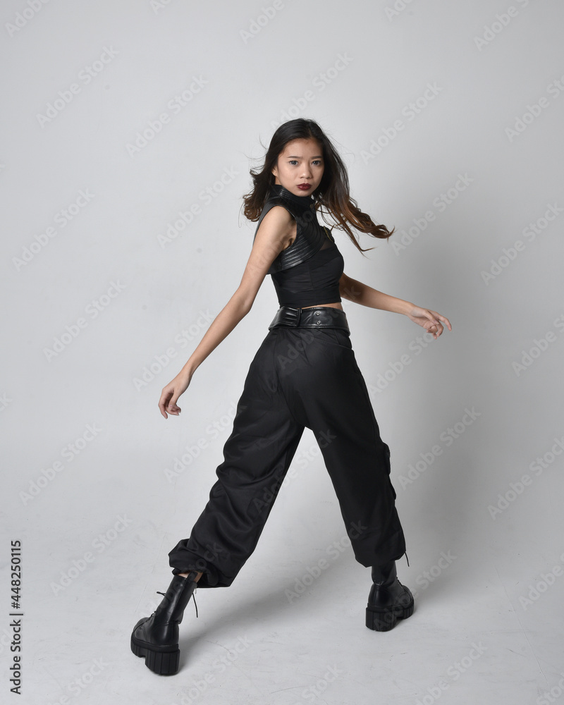 Full length portrait of pretty young asian girl wearing black tank top ...
