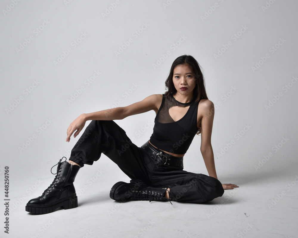 Full length portrait of pretty young asian girl wearing black tank top ...