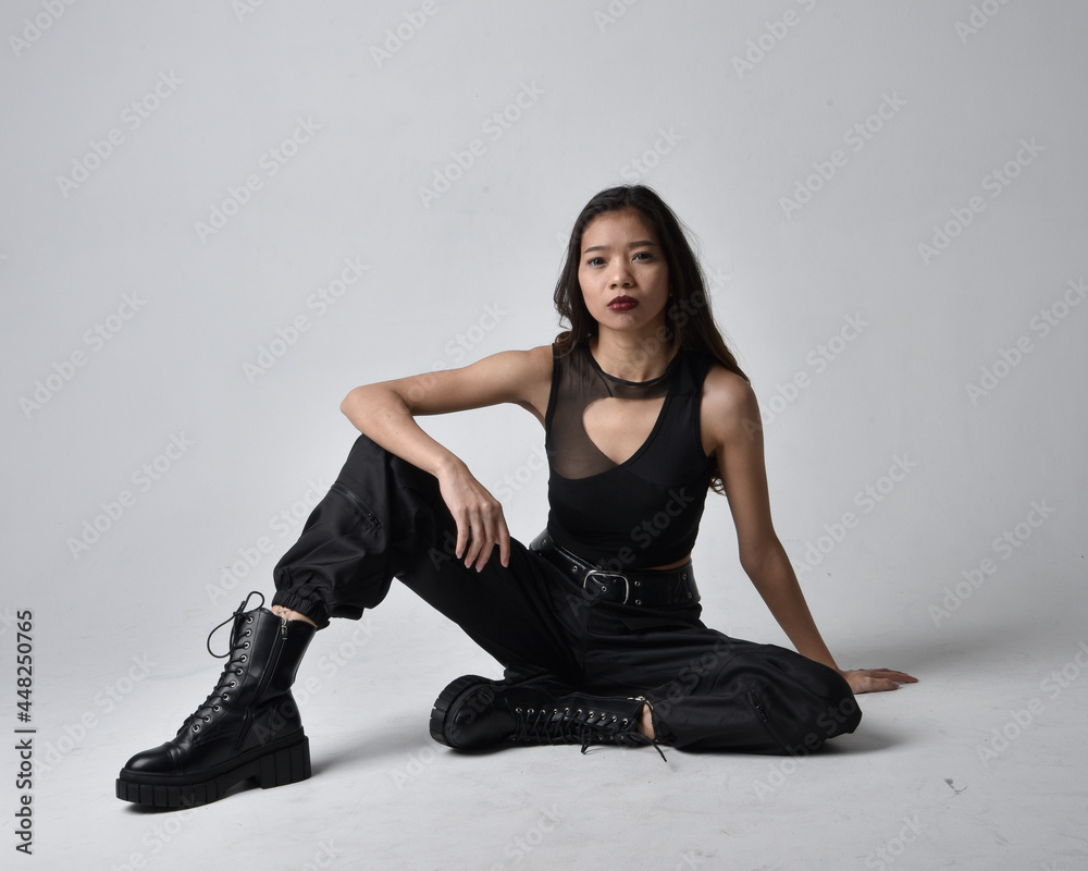 Full length portrait of pretty young asian girl wearing black tank top ...