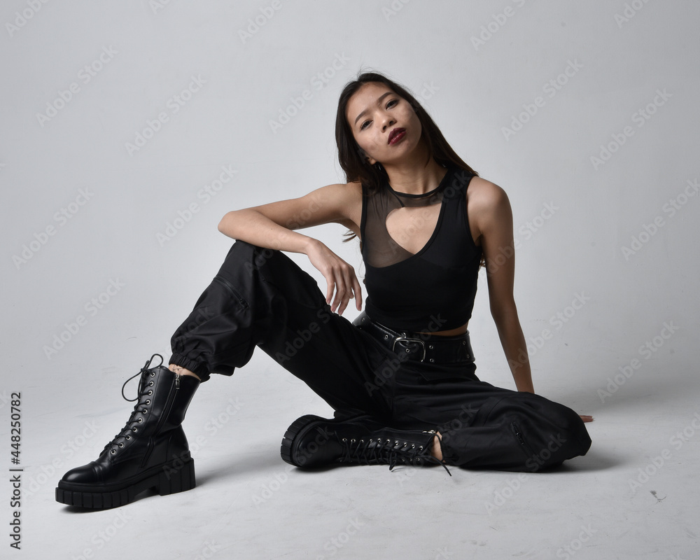 Full length portrait of pretty young asian girl wearing black tank top ...