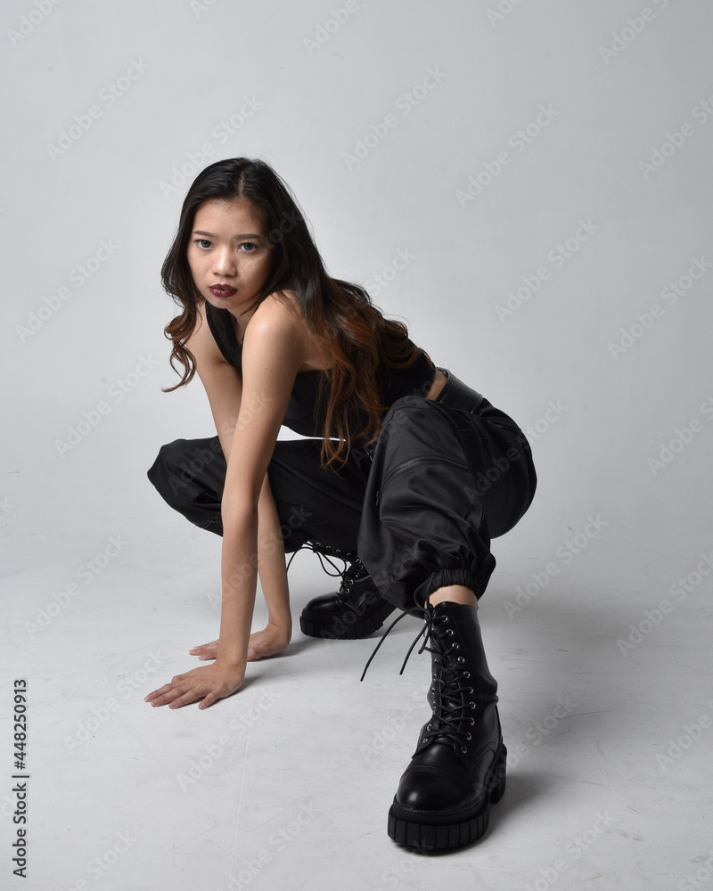 Full length portrait of pretty young asian girl wearing black tank top ...