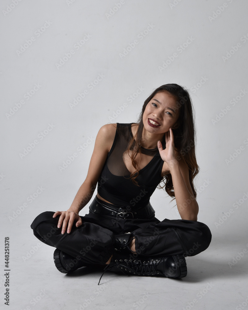Full length portrait of pretty young asian girl wearing black tank top ...