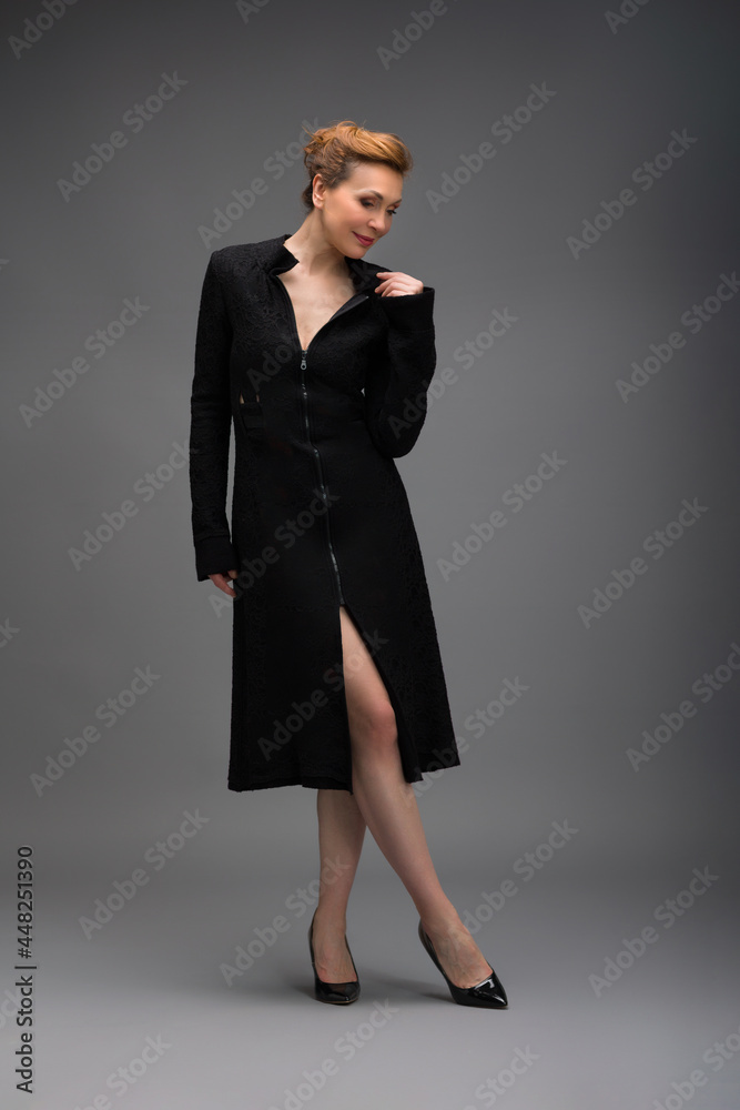 full length portrait of a fashionable aged woman isolated on grey full length portrait of a fashionable aged woman isolated on grey