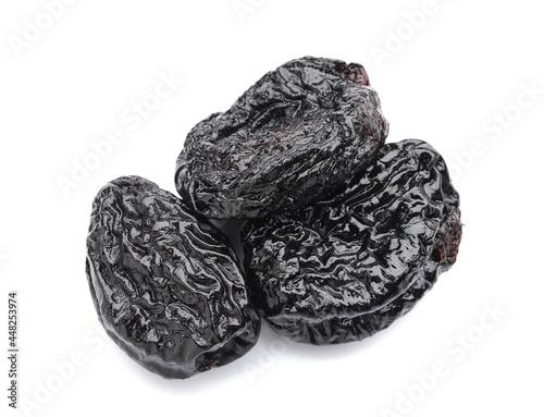 Tasty prunes on white background