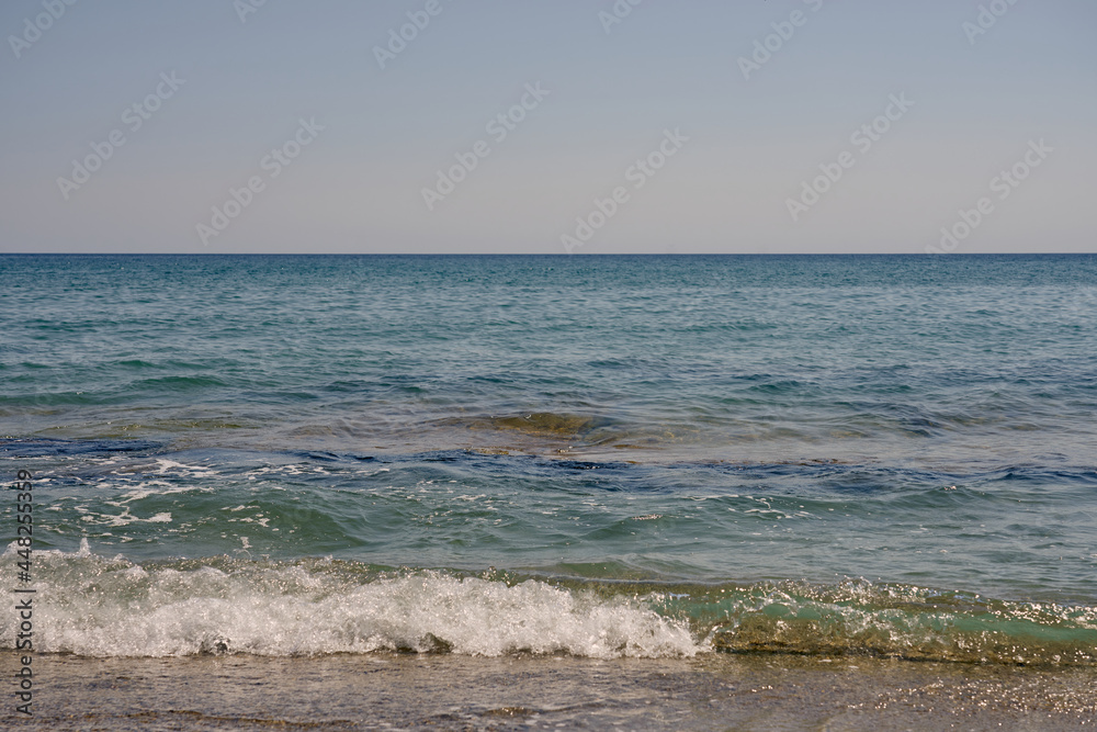 Waves with foam on Aegean sea coast in Crete Greece. Waves with foam on Aegean sea coast in Crete Greece.