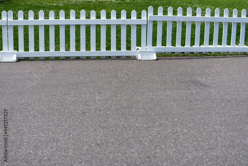 white fence on the road