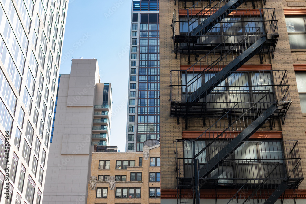 Fototapeta premium Buildings and Skyscrapers with Fire Escapes in Midtown Manhattan of New York City