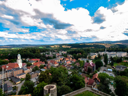 Aerial shot of a beautiful small Bolkow town in Poland under a blue cloudy sky photo