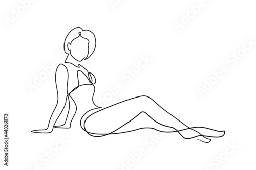Attractive woman posing in swimsuit in continuous line art drawing style. Fit woman relaxing and sunbathing minimalist black linear sketch isolated on white background. Vector illustration