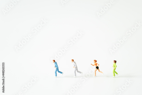 Miniature people running on oxygen level modern fingertip pulse oximeter on white background with copy space using for Healthy lifestyle and sport fitness medicine health care avoid COVID-19 concepts