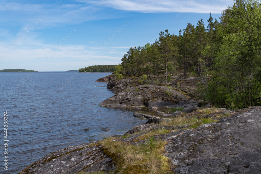 Skerry of Ladoga. Stony lake shore on Great Ladoga Trail. Leningrad region. Russia. Skerry of Ladoga. Stony lake shore on Great Ladoga Trail. Leningrad region. Russia.