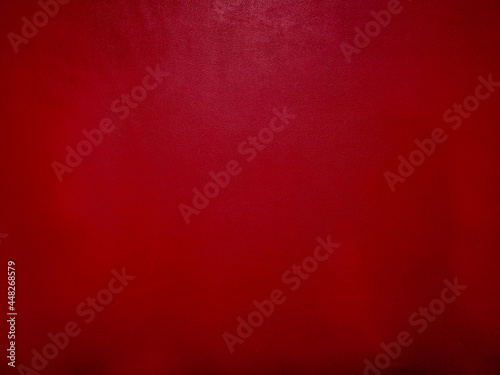 Dark red leather background with empty copy space. Dark red leather texture.
