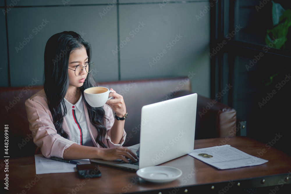 Businesswoman taking coffee at a cafe