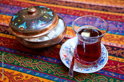 Black Turkish tea in traditional glass photo