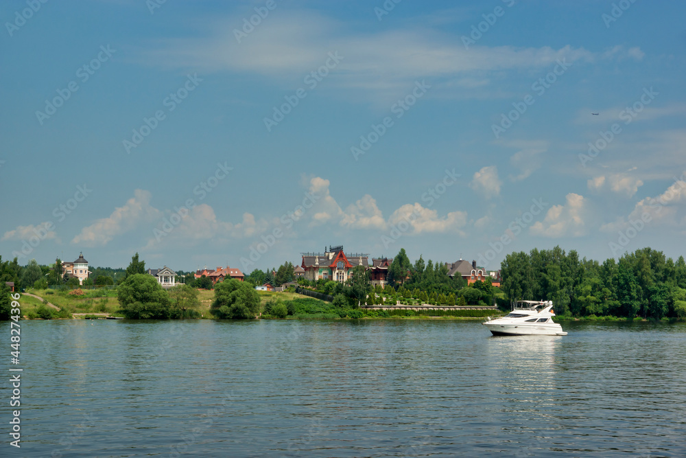 View of the embankment of the Klyazmensky reservoir, river walk along the Moscow water channel, Russia