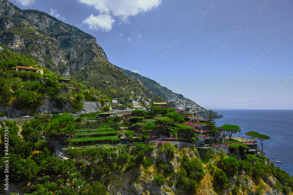 One of the best resorts of Italy with old colorful villas on the steep slope, nice beach, numerous yachts and boats in harbor and medieval towers along the coast, Positano.