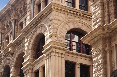 Close up of the architectural detailing of a refurbished heritage sandstone building. Now retail and office space. former headquarters for the American Equitable Life Assurance Society