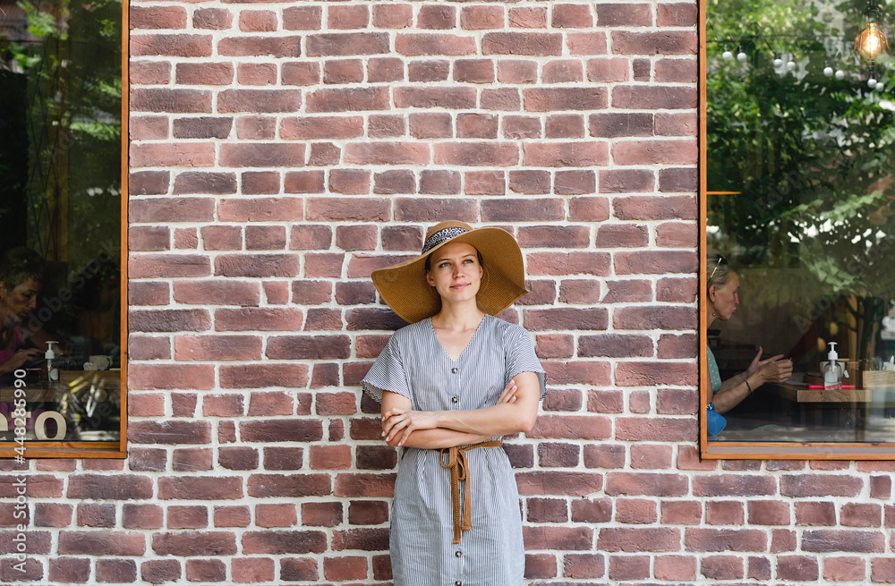 portrait of a beautiful young woman on a background of red bricks portrait of a beautiful young woman on a background of red bricks