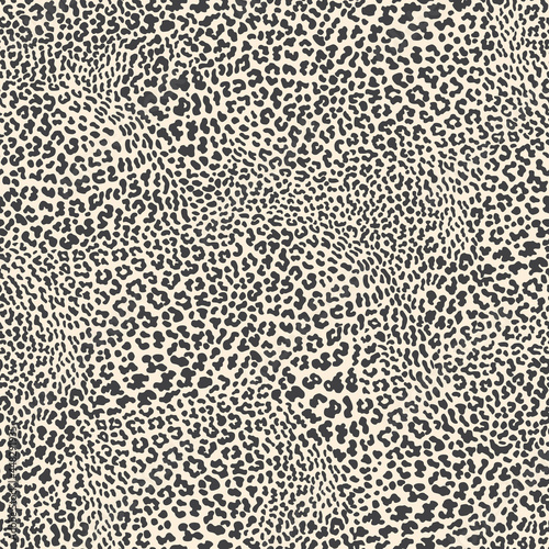 Vector animalistic seamless pattern from leopard skin spots.
 Trendy black and beige background. Batik, wallpaper, wrapping paper, silk chintz textile print
