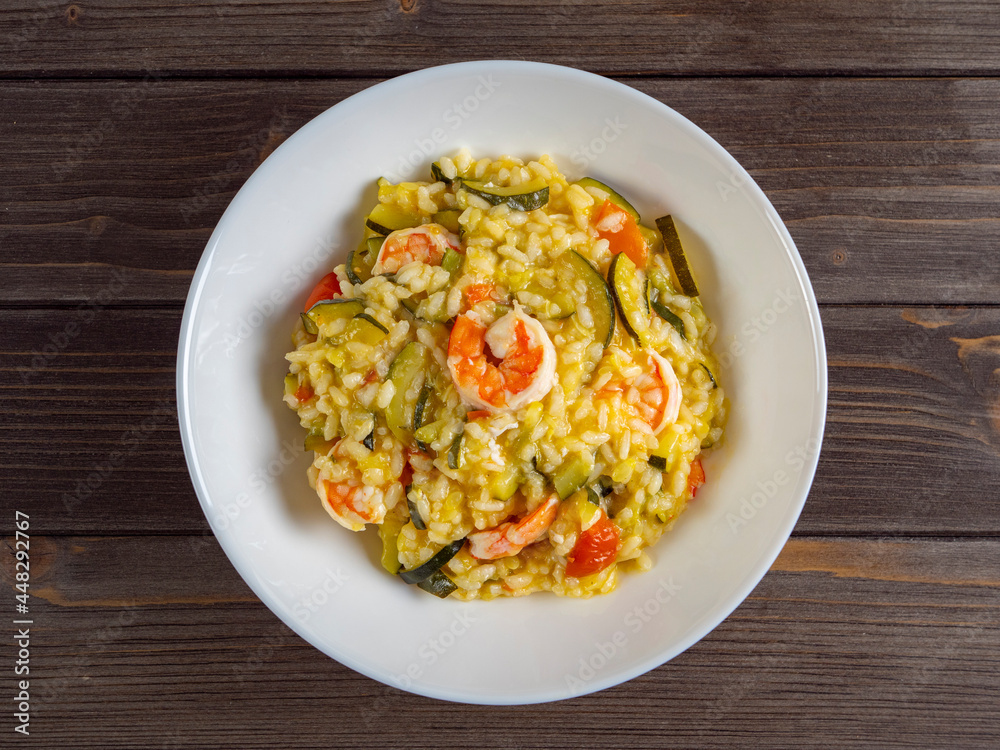 risotto with shrimp and zucchini, recipe made from rice and seafood, still life of food top view flat lay risotto with shrimp and zucchini, recipe made from rice and seafood, still life of food top view flat lay