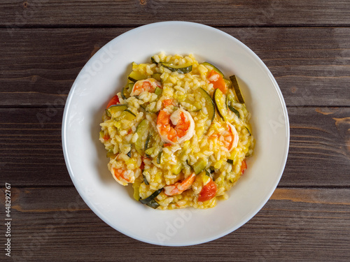 risotto with shrimp and zucchini, recipe made from rice and seafood, still life of food top view flat lay
