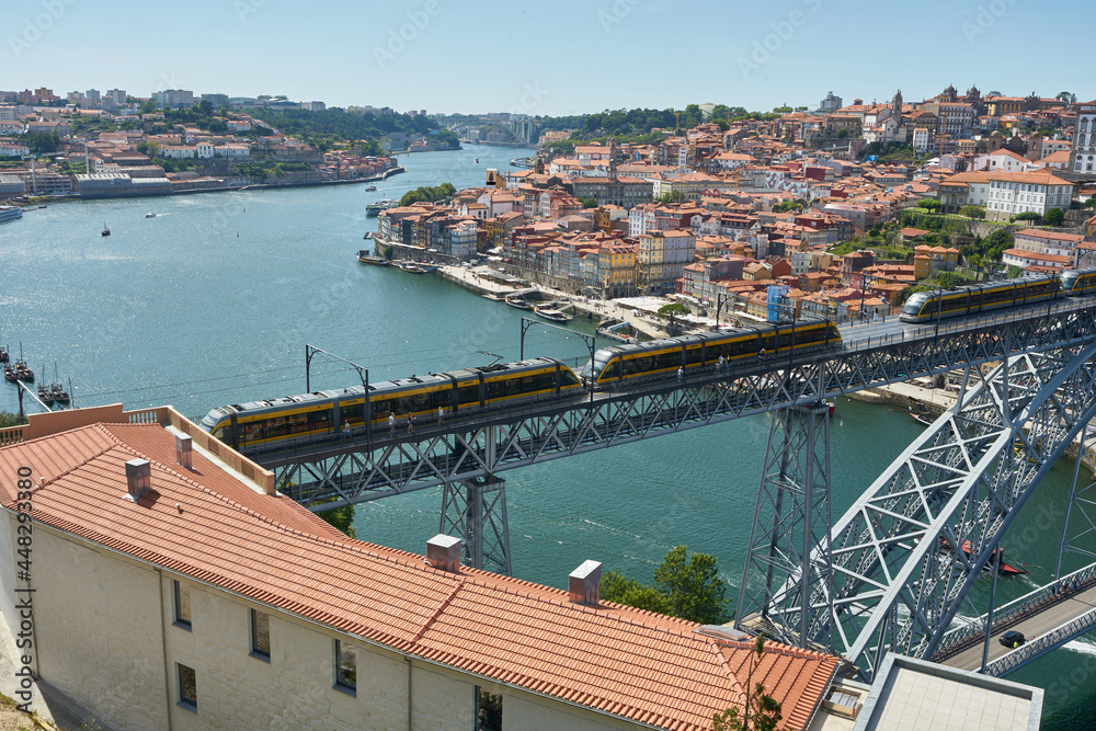 The tram of Porto crossing Louis I Bridge, Portugal