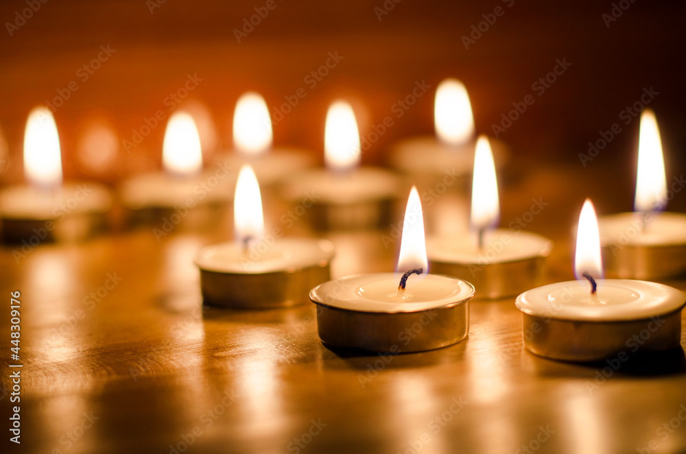 Group of handmade aroma wax candle on wooden background at night time in spa shop