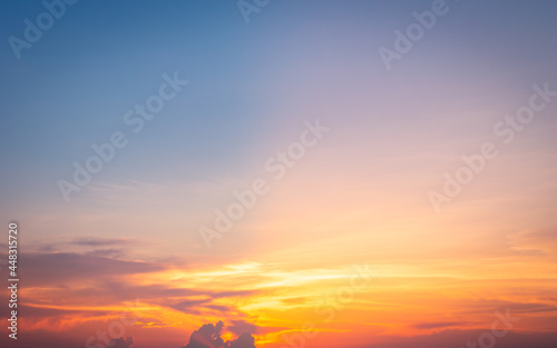Beautiful Vivid sky painted by the sun leaving bright golden shades.Dense clouds in twilight sky in winter evening.Image of cloud sky on evening time.Evening Vivid sky with clouds.