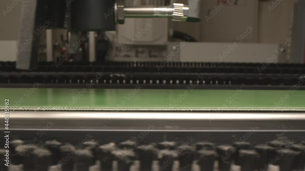 Automatic production line with modern equipment transports green material in fridges manufacturing plant workshop closeup Automatic production line with modern equipment transports green material in fridges manufacturing plant workshop closeup