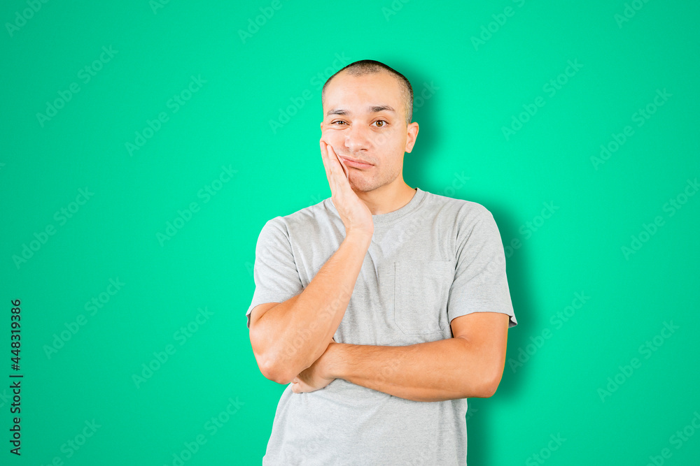 Bored man thinking something on studio Bored man thinking something on studio