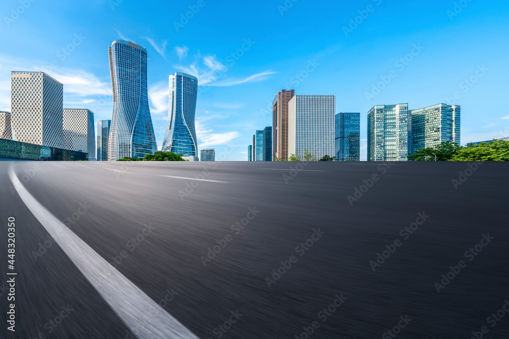 Fototapeta premium Skyline of Asphalt Pavement and Urban Architecture