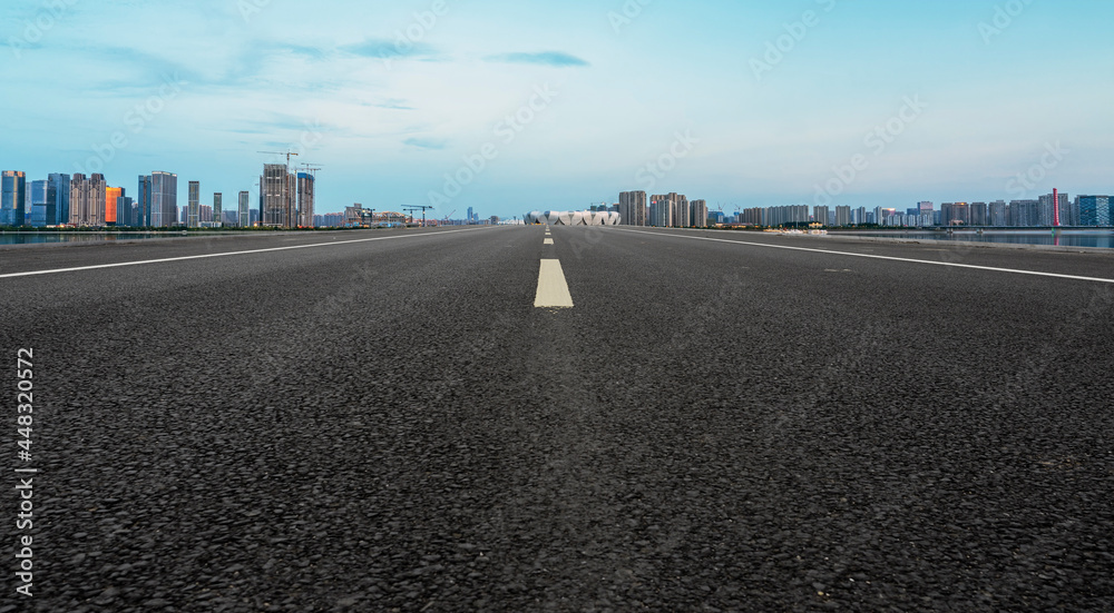 Fototapeta premium Skyline of Asphalt Pavement and Urban Architecture