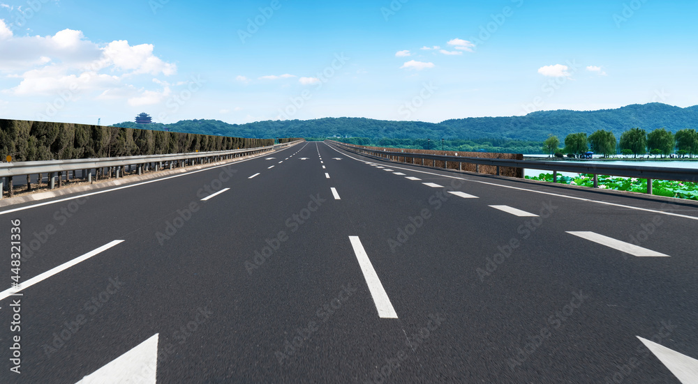 Skyline of Asphalt Pavement and Blue Sky and White Cloud Skyline of Asphalt Pavement and Blue Sky and White Cloud