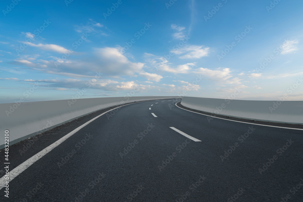 Skyline of Asphalt Pavement and Blue Sky and White Cloud