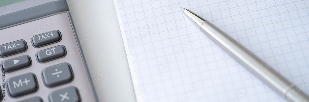 Template with caculator pen notepad on white table top view background. Template with caculator pen notepad on white table top view background.