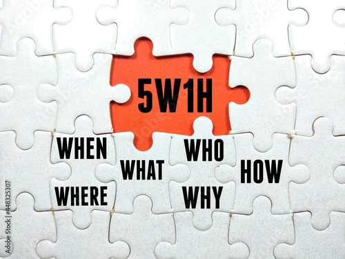 Business concept.Text 5W1H WHEN,WHERE,WHAT,WHO,WHY and HOW with jigsaw puzzle on red background. photo