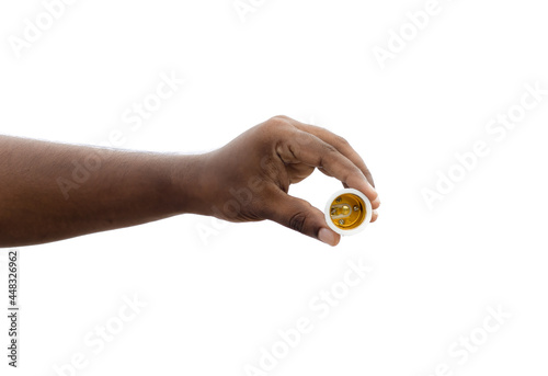 Traditional light holder holding a hand on isolated white background