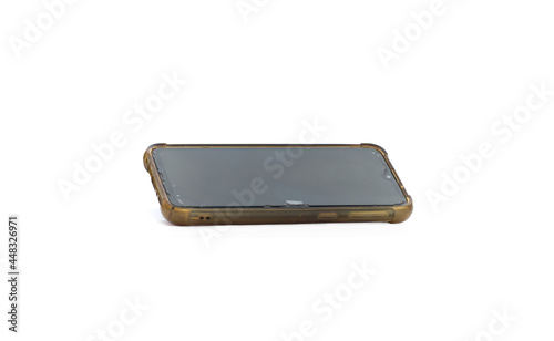 Used old smartphone with cracked screen protector on isolated white background