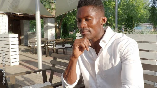 Ivanovo, Russia July 21, 2021, African-American businessman, works at a laptop in a cafe, freelancer