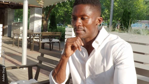 Ivanovo, Russia July 21, 2021, African-American businessman, works at a laptop in a cafe, freelancer